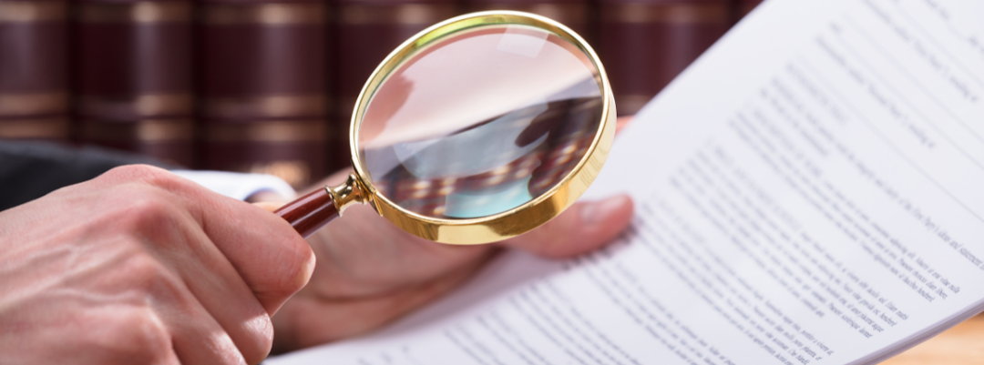 Magnifying glass over top of a document