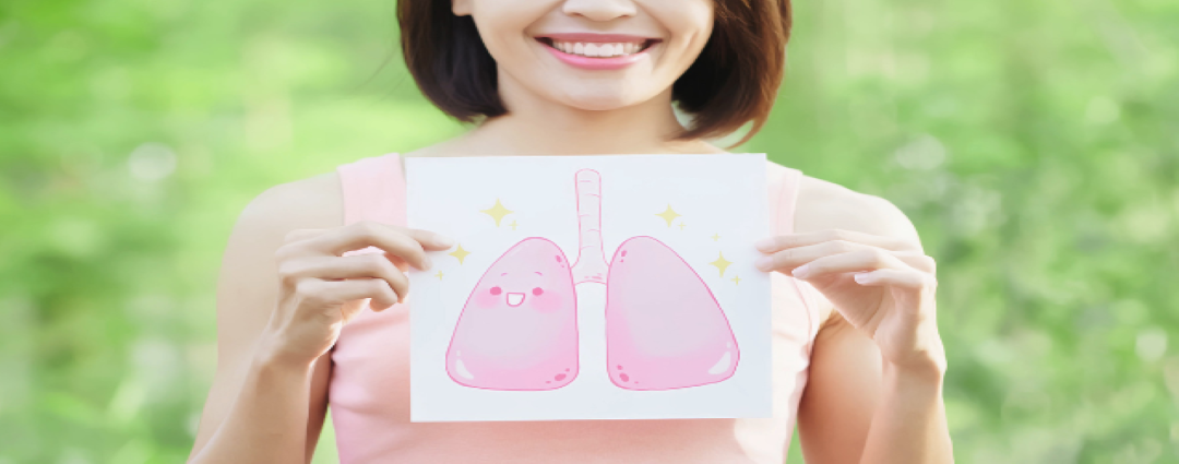 woman holding picture of lungs outdoors
