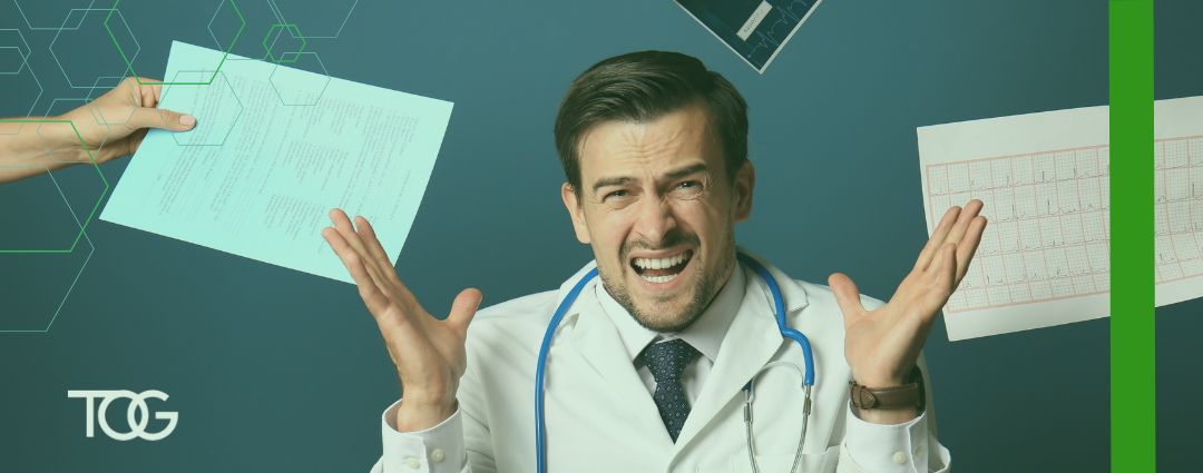 Frustrated doctor throws two papers up in the air.
